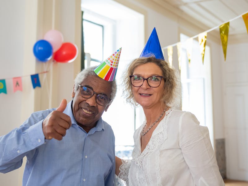 Senior participant being safely assisted with door-to-door transportation
